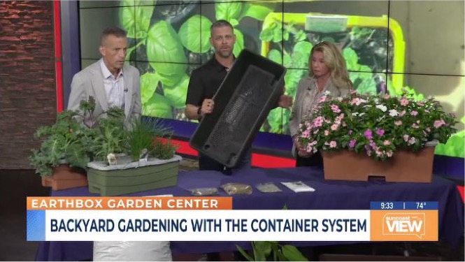 Will Carlton demonstrates an EarthBox with the Suncoast View hosts
